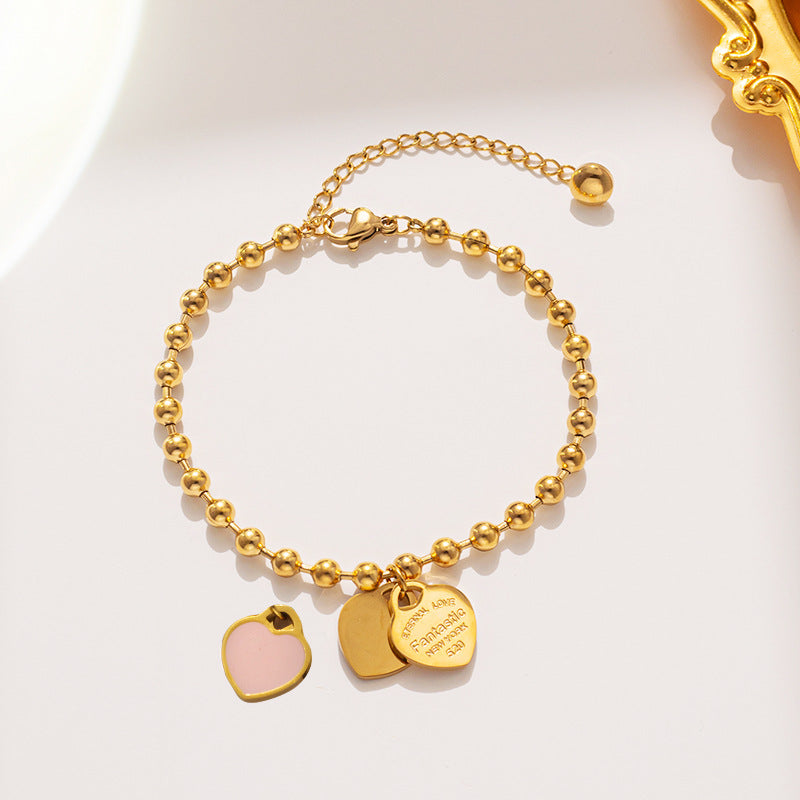 Bracciale minimalista da donna in acciaio al titanio a forma di cuore con finitura placcata