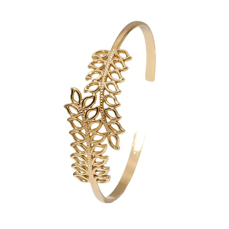 Bracciale da donna in acciaio inossidabile a forma di foglia minimalista con design a traforo e finitura placcata