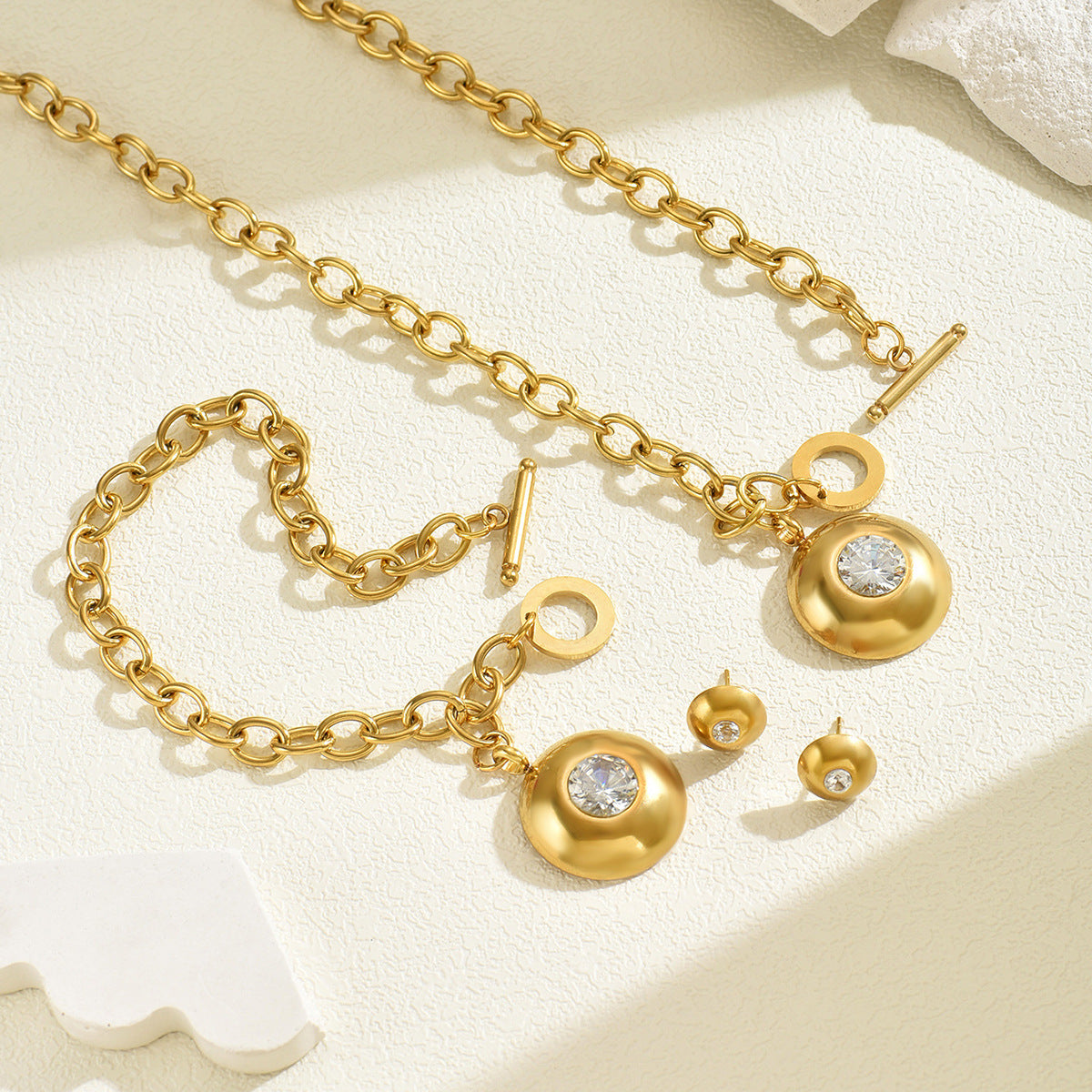 Conjunto de collar y pulsera redondos geométricos con incrustaciones de circonita para mujer con cadena de cobre