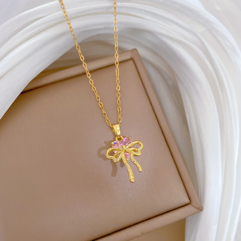 Collana con ciondolo a fiocco rosa con strass da donna in acciaio al titanio con catena a locket delicata