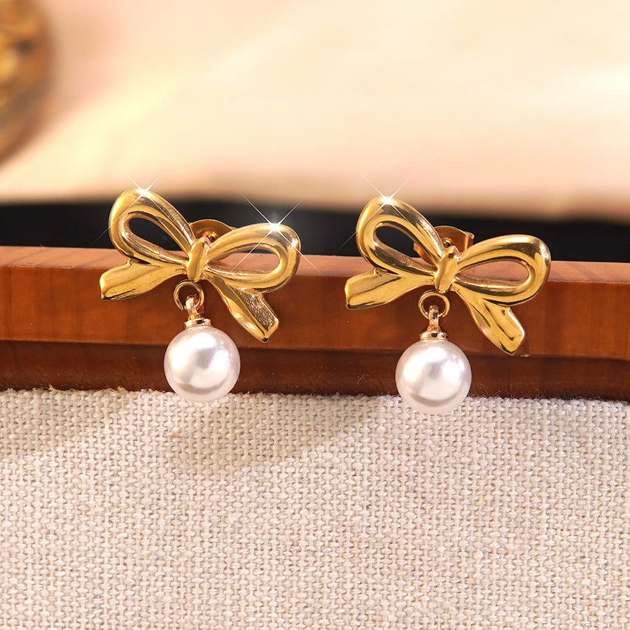 Elegante parure collana e orecchini in acciaio inossidabile con fiocco e perle, con catena a maglie forzatine