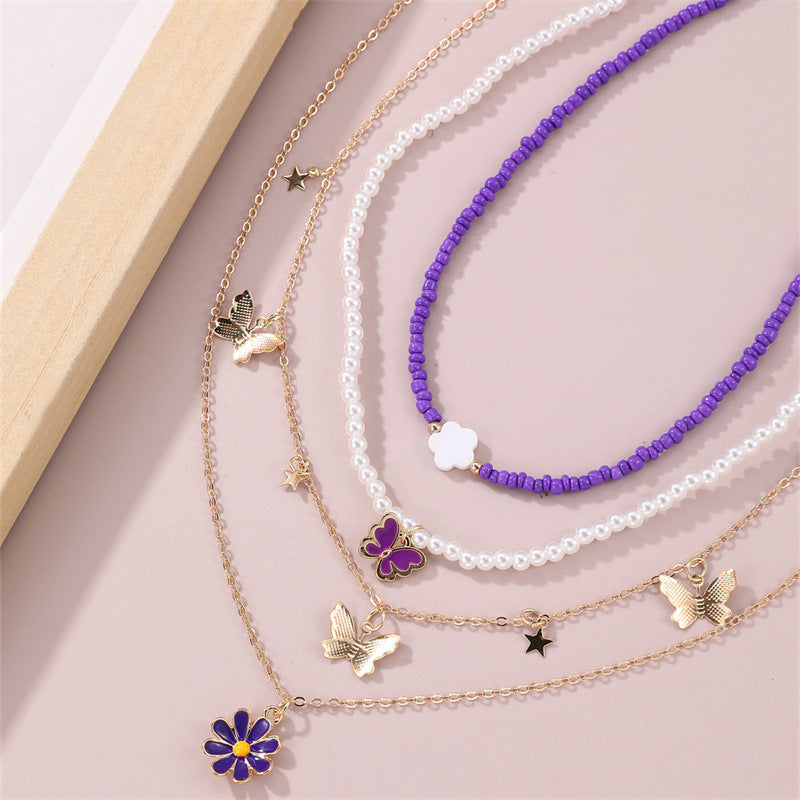 Set collana con pendente a farfalla rosa e floreale per bambini con perle in resina e ciondolo in lega, finitura smaltata, catena a sfere rotonde