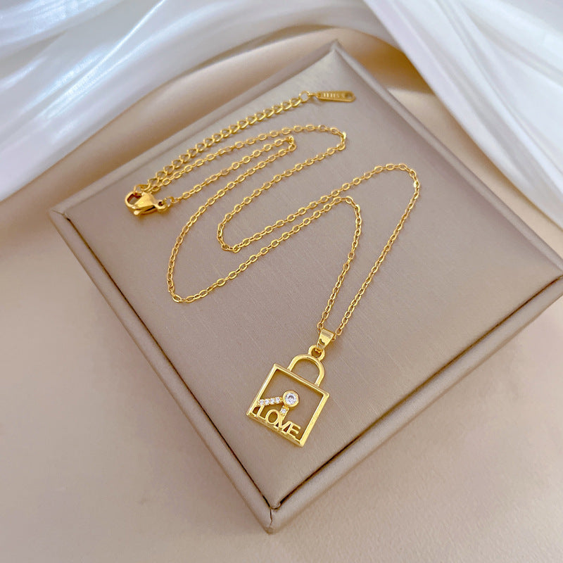 Minimalist Geometric LOVE Key Lock Pendant Necklace for Women and Men in Titanium Steel with Rhinestone Accents on Snake Chain