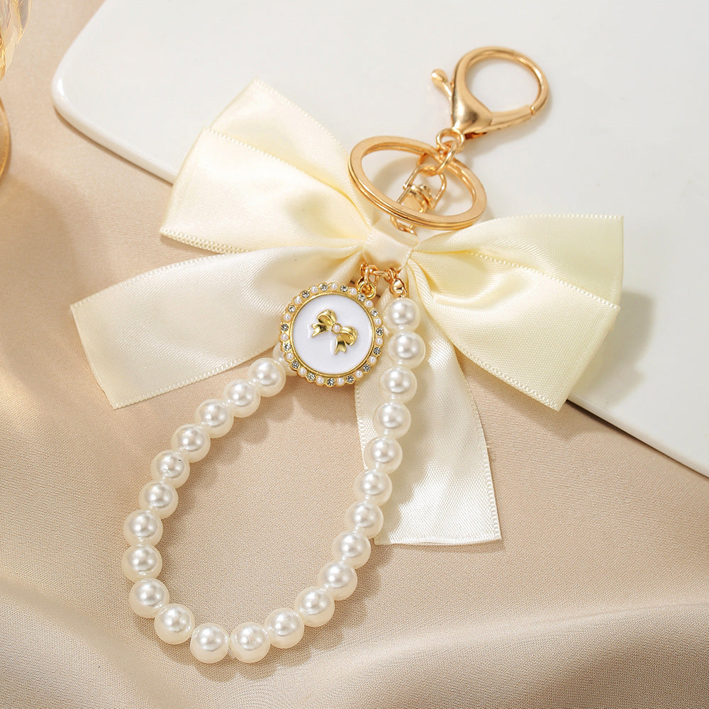 Sweet Cartoon Bow Pearl Zinc Alloy Keychain Bag Charm