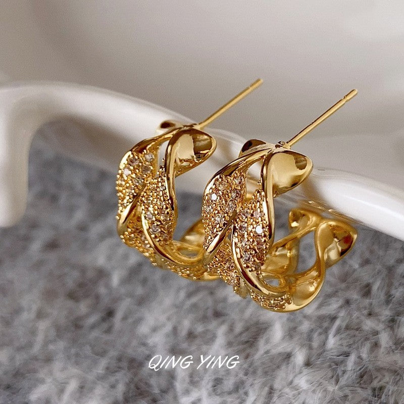 Orecchini a perno Saturno minimalisti color oro in ottone con zirconi per donna