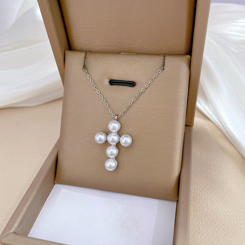 Collana a croce geometrica minimalista in acciaio al titanio con accento floreale