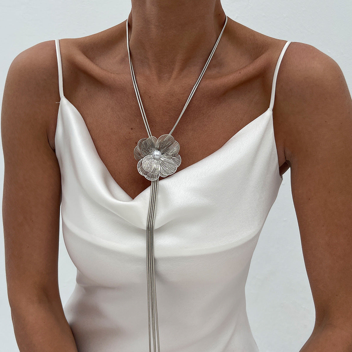 Minimalist Ginkgo Leaf Long Tassel Necklace with Hollow Floral Pendant, Electroplated Copper Chain and Simulated Pearl Accents for Women