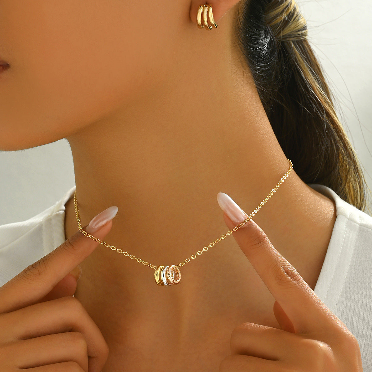 Conjunto de collar y pendientes de diseño geométrico minimalista chapados en cobre para mujer, con diseño de líneas ovaladas y circulares