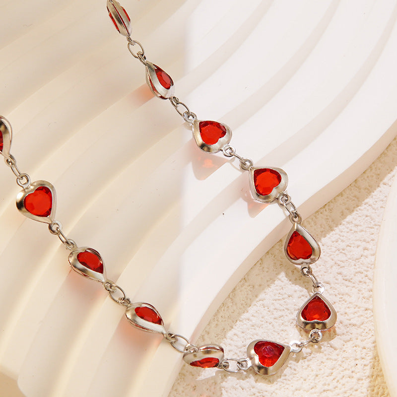 Elegante set collana e bracciale in acciaio inossidabile con zirconi cubici a cuore per donna