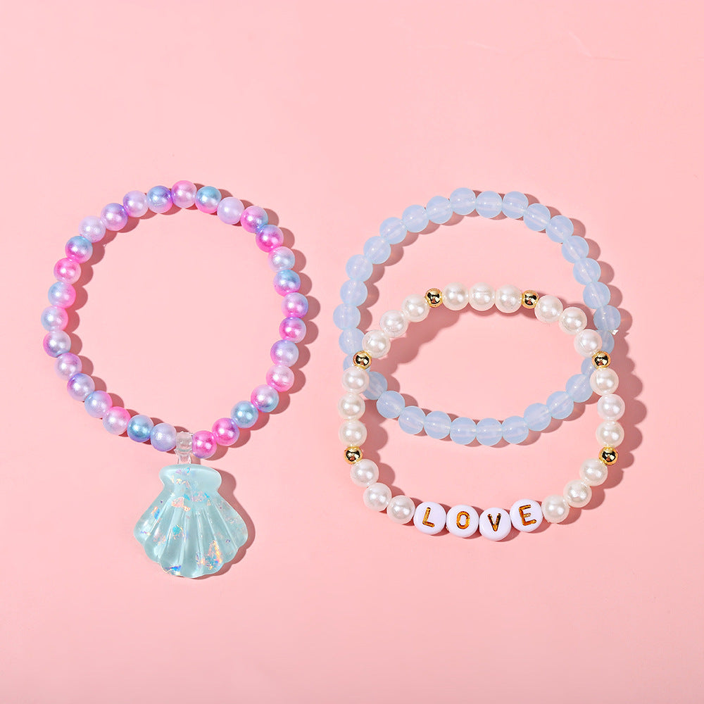 Juego de pulseras de resina con cuentas en forma de corazón estilo caricatura con dijes de cola de sirena y conchas marinas para niños