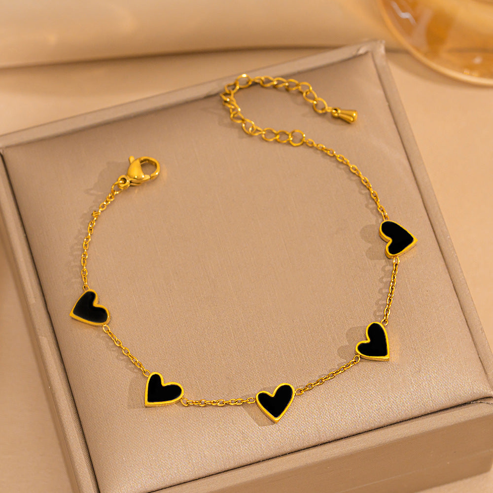 Pulsera minimalista de lujo ligero con forma de corazón de acero de titanio con PVD y oro blanco de 18 quilates y nácar para mujer
