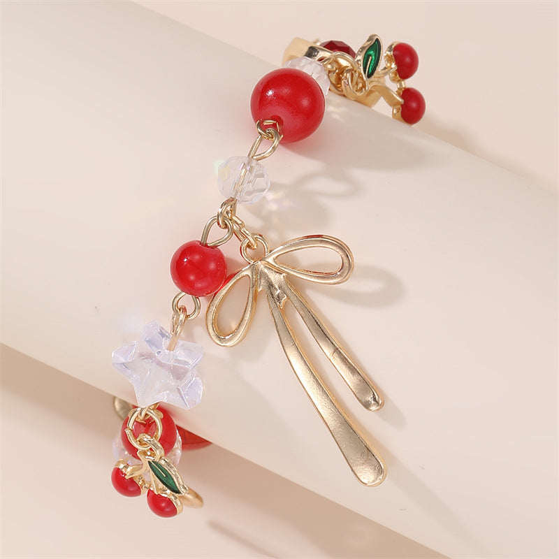 Pulsera con dije de lazo de corazón de cereza dulce para niñas, hecha de resina con detalles artesanales
