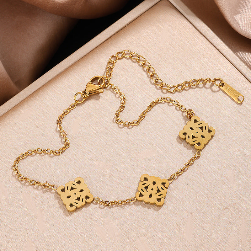 Set Collana e Bracciale in Acciaio Inossidabile con Tagli Geometrici Vuoti di Lusso Placcato Oro 18K