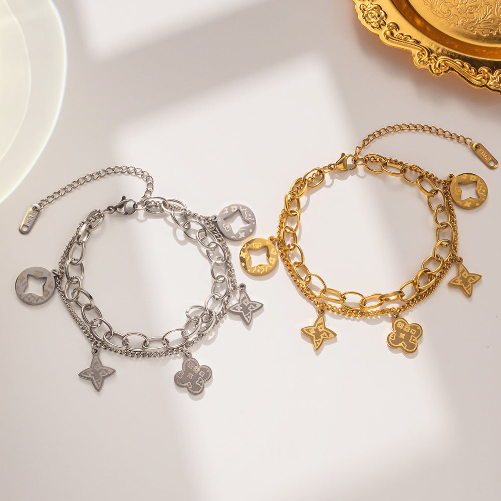 Elegante Pulsera Minimalista de Acero de Titanio con Colgante Redondo Bañado en Oro de 18K y Dije de Hoja para Mujer