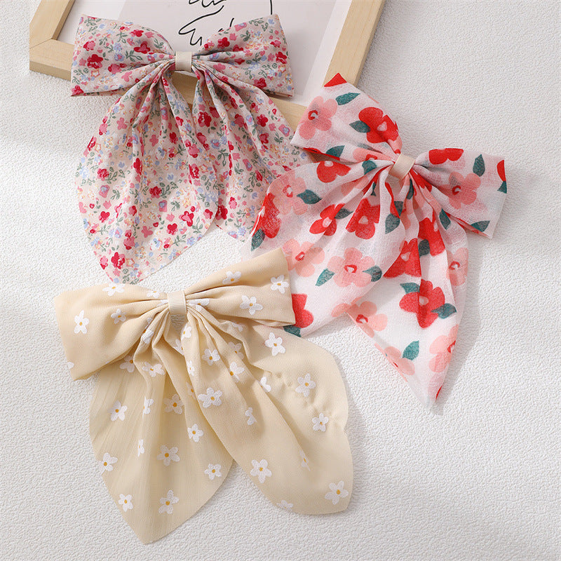 Set di fermagli per capelli con fiocco in tessuto stile dolce per bambini con stampa floreale e piccoli nastri decorativi