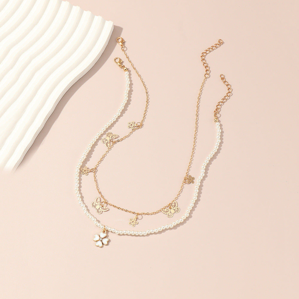 Collar minimalista de aleación con forma de mariposa y cadena de perlas para niñas de 6 años en adelante, collar con colgante de trébol de cuatro hojas y cuentas