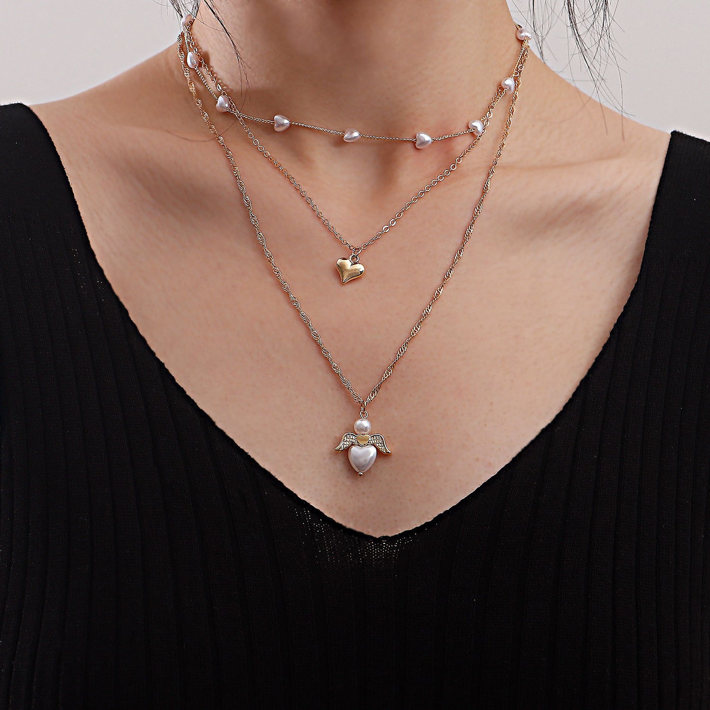 Minimalist Multi-Layer Heart-Shaped Pearl and Angel Wing Necklace for Women in Alloy with Plated Finish