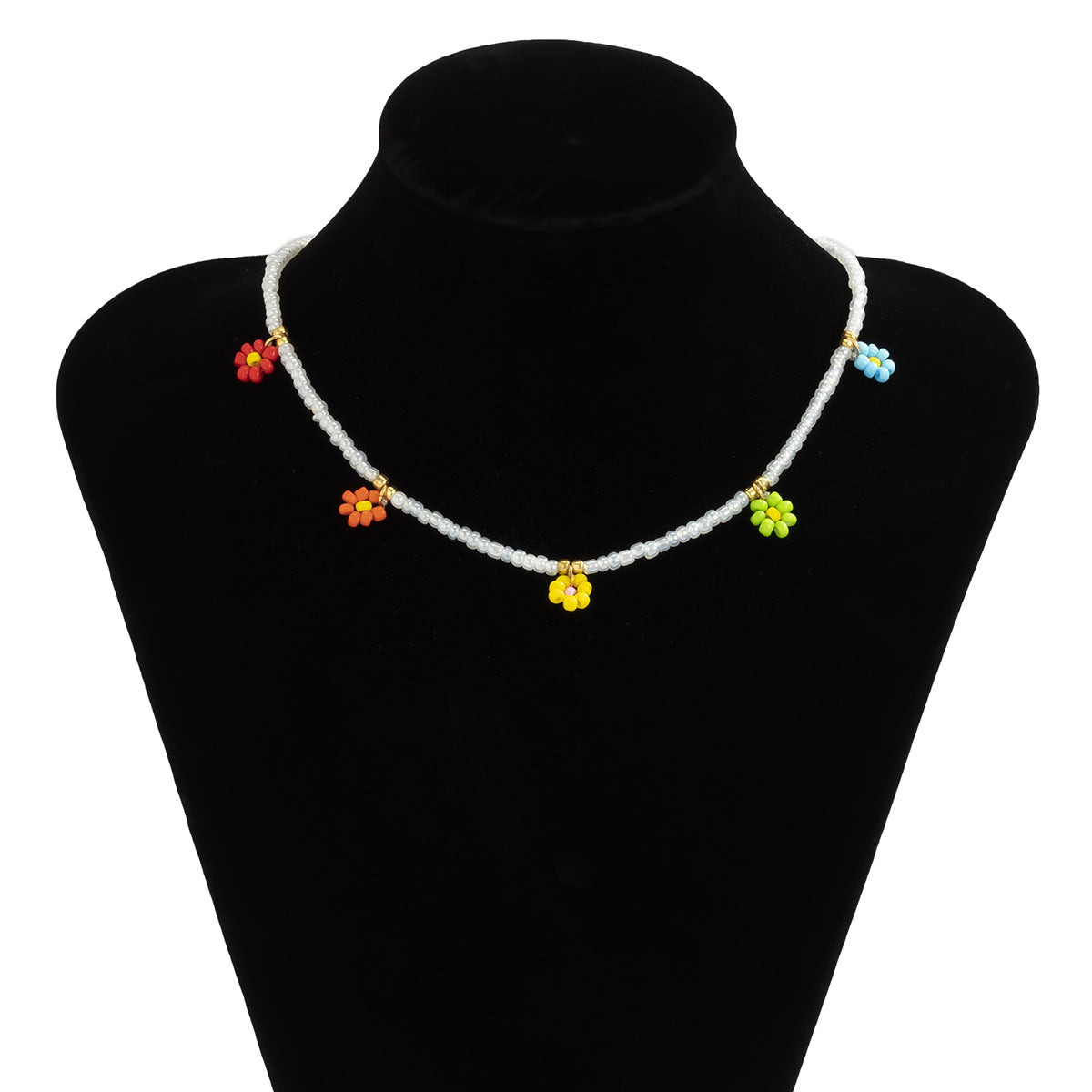 Collana pendente margherita minimalista con dettaglio nappa da donna, con accenti in resina e perline, design floreale rotondo su catena a sfere
