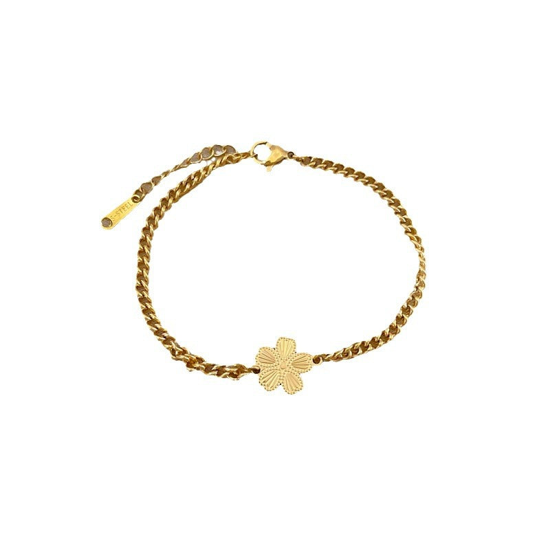 Minimalist Titanium Steel Five-Petal Flower Hand Chain for Women with Gold Plating and Wavy Texture Design