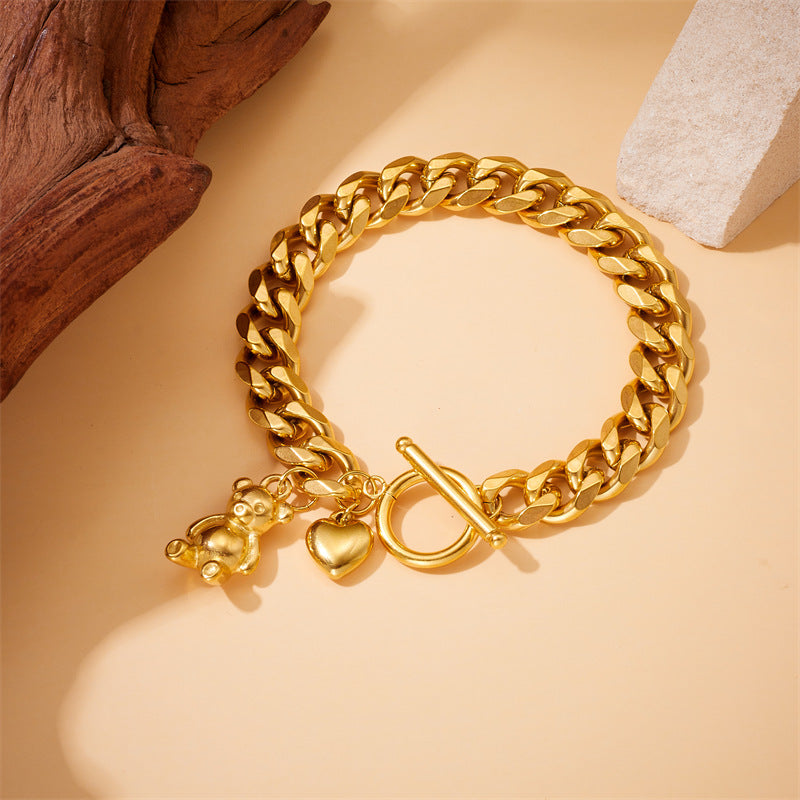 Bracciale da donna placcato oro in acciaio inossidabile con ciondoli a orsetto e cuore e chiusura a moschettone