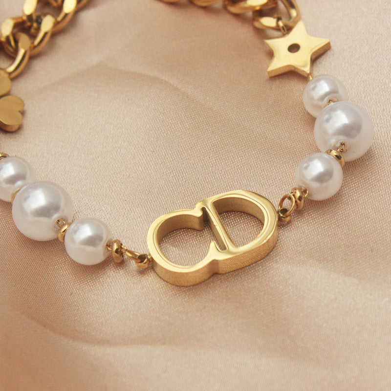 Sweet Minimalist Titanium Steel Bracelet with Gold Plated CD Star and Leaf Charms for Women