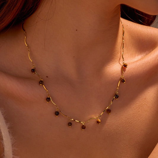 Collana con pendente a occhio di tigre minimalista da donna con catena in acciaio inossidabile e finitura placcata