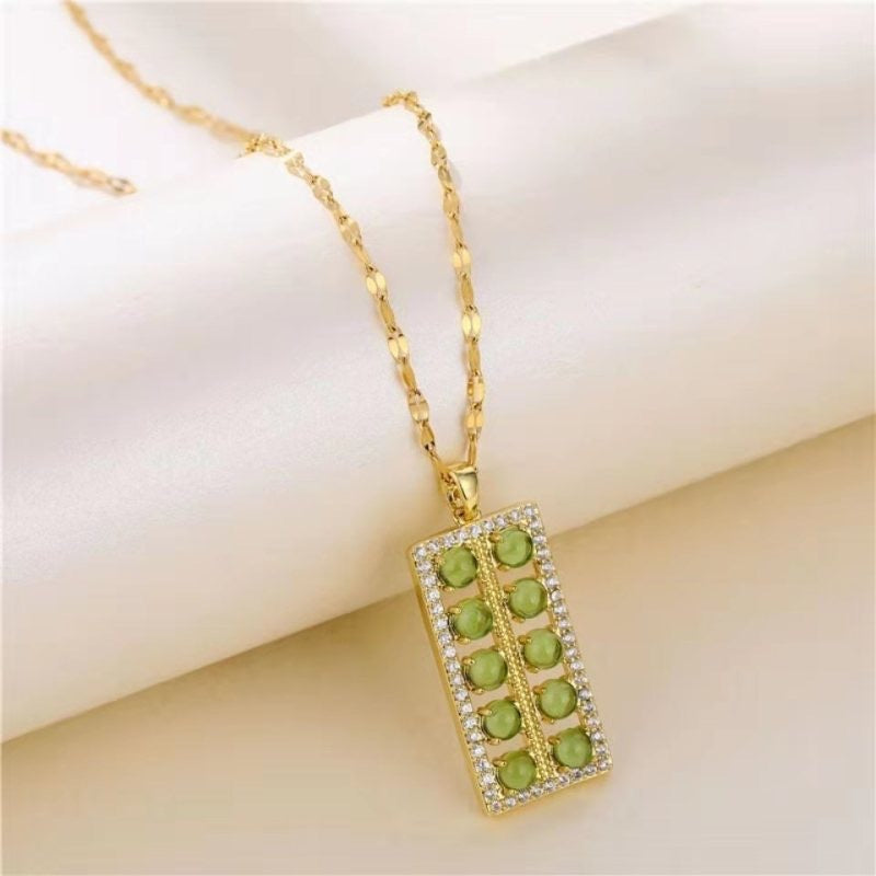 Collana con ciondolo floreale dal design originale per donne e uomini in acciaio al titanio con intarsio in rame placcato oro e catena a O