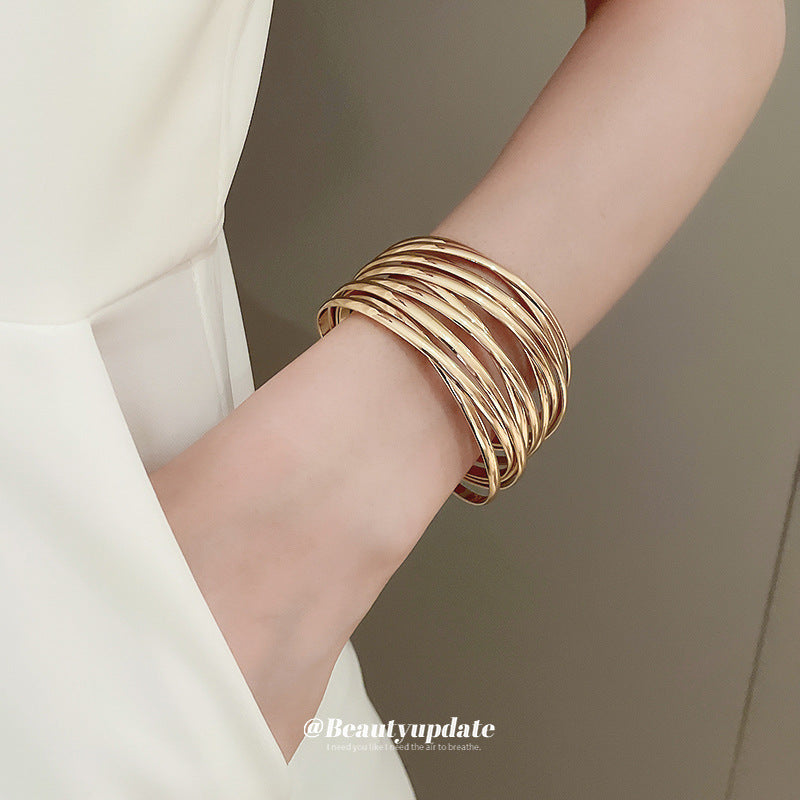 Bracciale rigido aperto geometrico minimalista in lega con finitura placcata per donna