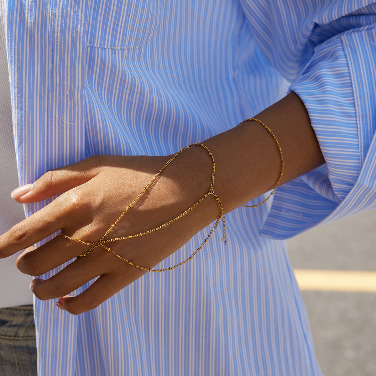 Pulsera de dedo de doble capa con borla geométrica de acero inoxidable y abalorios con acabado chapado para mujer