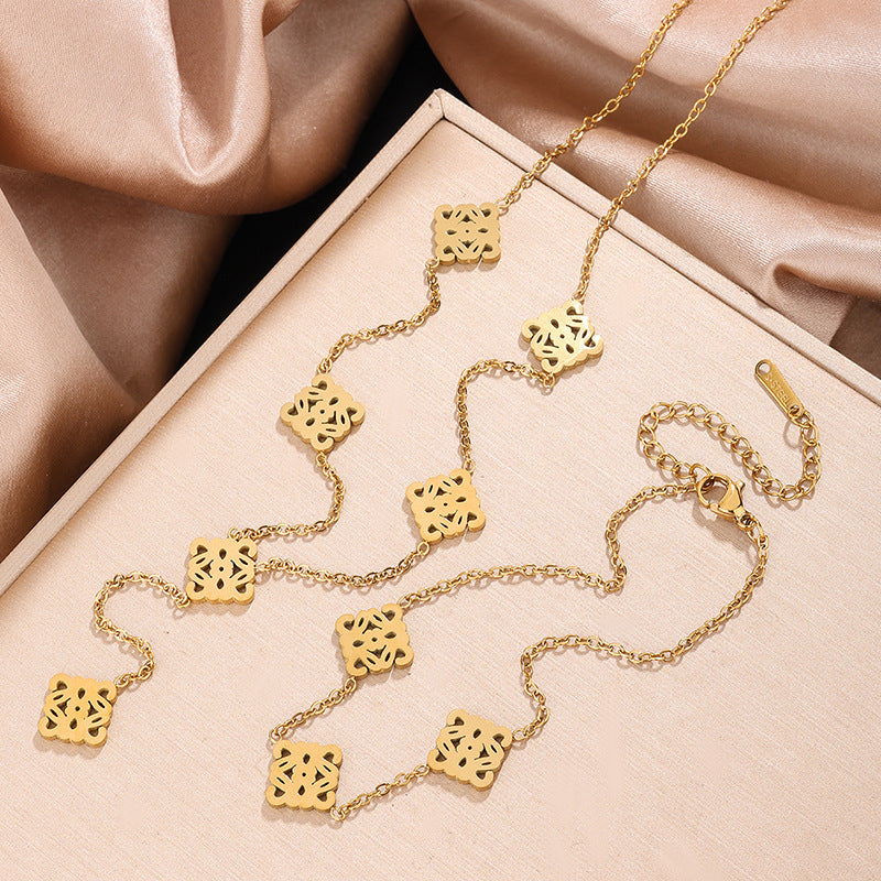 Set Collana e Bracciale in Acciaio Inossidabile con Tagli Geometrici Vuoti di Lusso Placcato Oro 18K