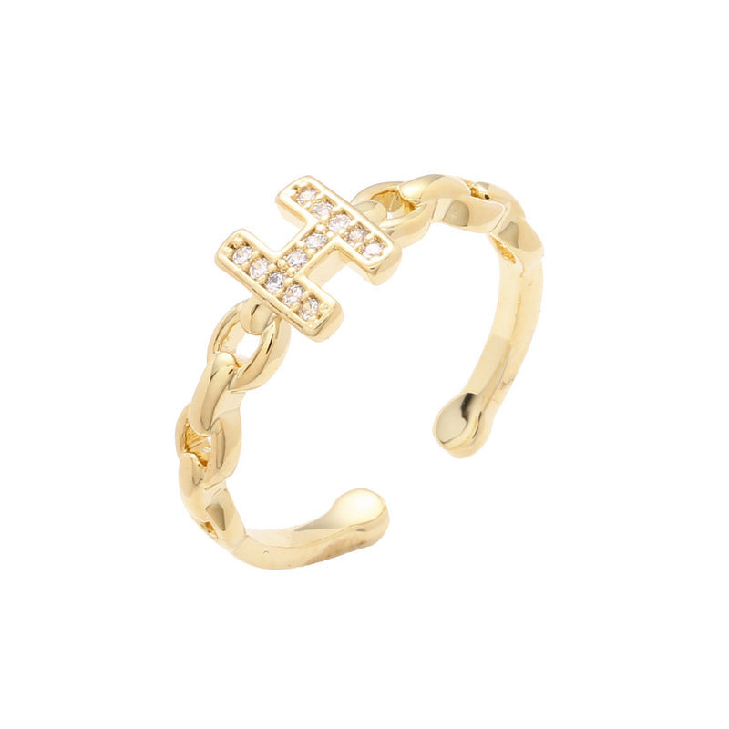 Anello minimalista con lettera H in ottone placcato oro con dettagli in strass e fascia aperta regolabile