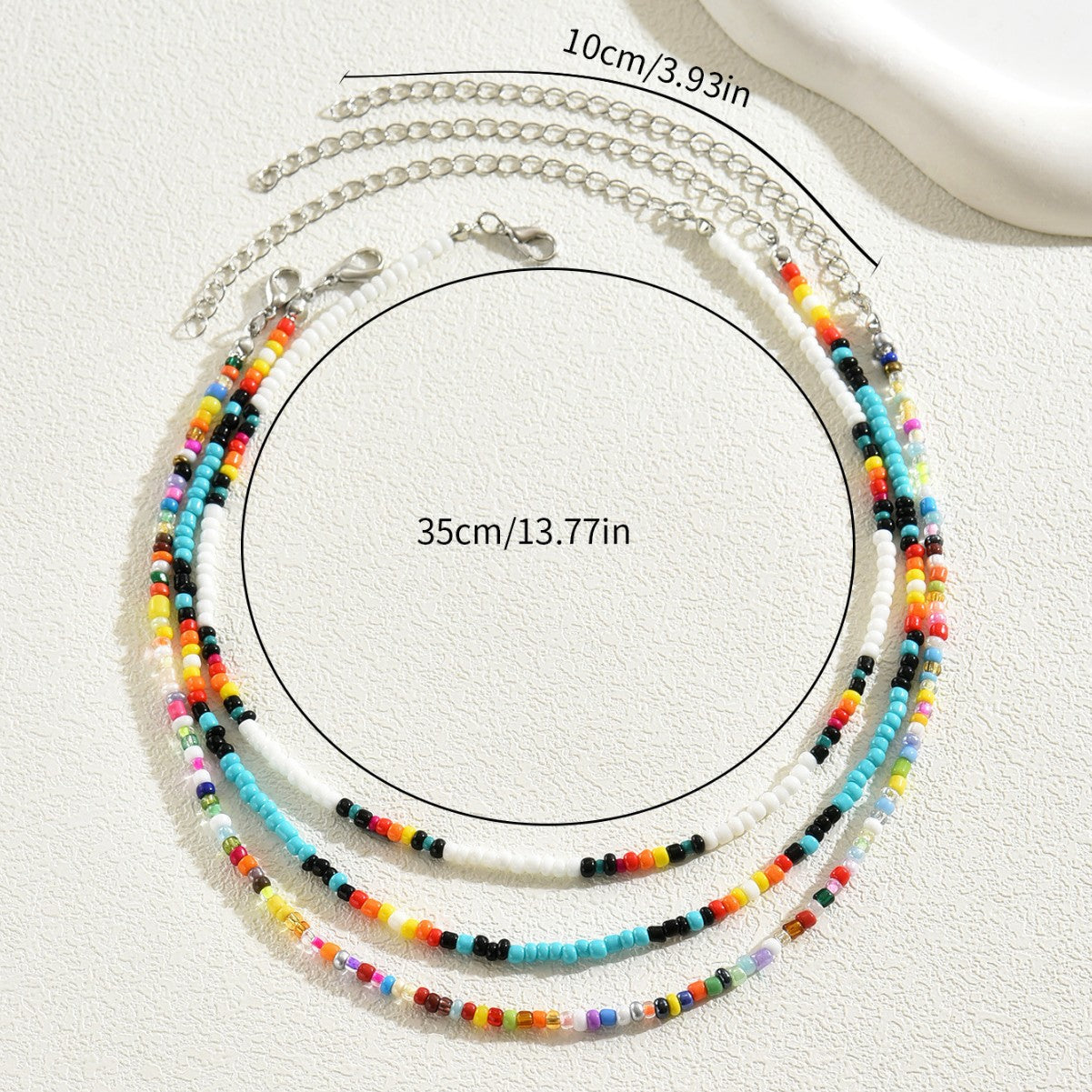 Collar largo de clavícula con múltiples capas geométricas para mujer, con cuentas de semillas coloridas tejidas a mano y diseño elíptico lineal