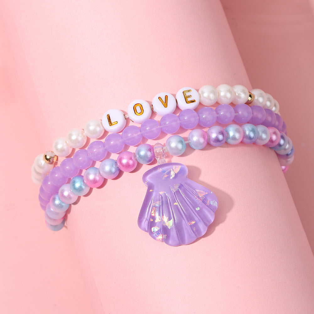 Juego de pulseras de resina con cuentas en forma de corazón estilo caricatura con dijes de cola de sirena y conchas marinas para niños