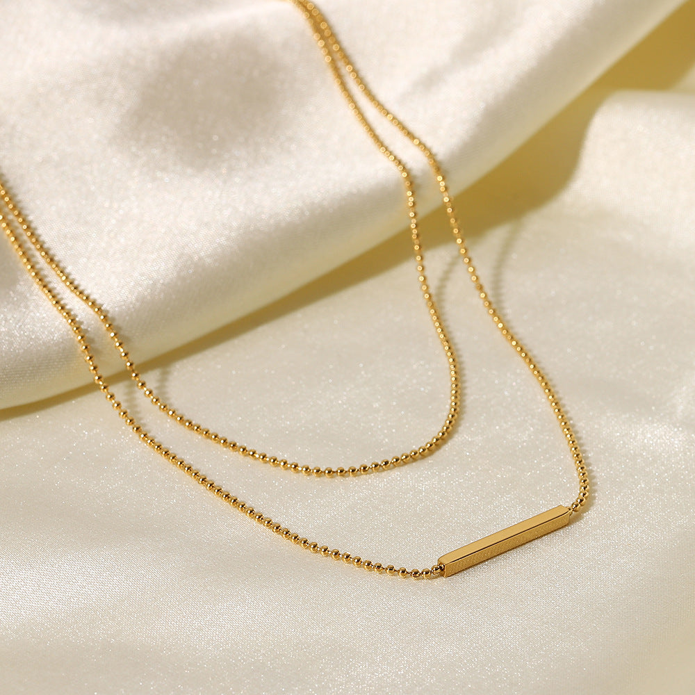 Collana doppia a strati a barra a T geometrica in acciaio inossidabile con pendente in acciaio al titanio placcato oro 18 carati da donna