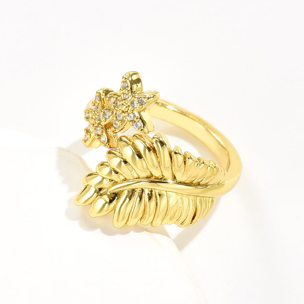 Anello da donna a forma di fiore a foglia geometrica in rame con placcatura in oro 18 carati e zirconi micro-pavé