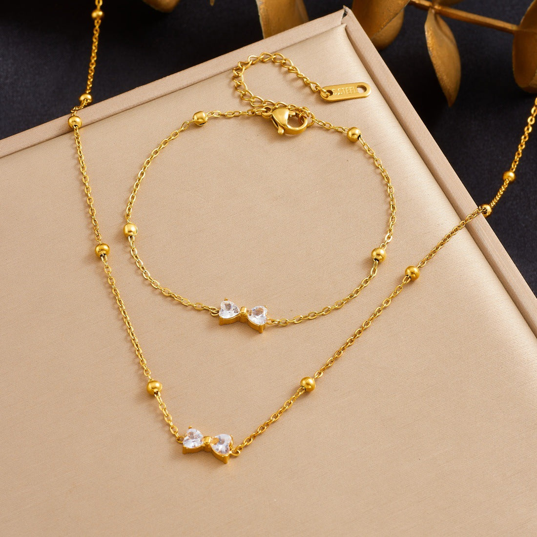 Minimalist Gold Plated Stainless Steel Rhinestone Bow Pendant Necklace and Earring Set for Women