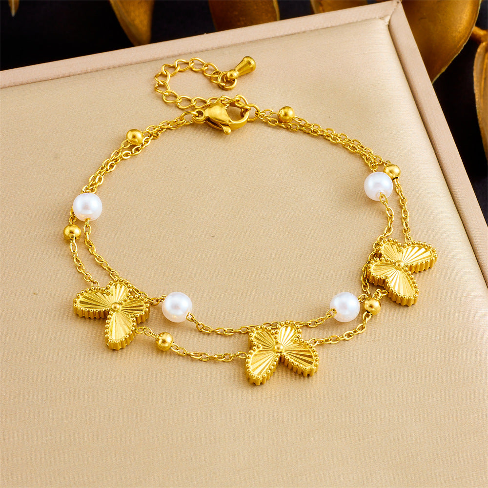 Bracciale minimalista da donna in acciaio inossidabile a forma di fiocco con placcatura in oro e inserti di perle