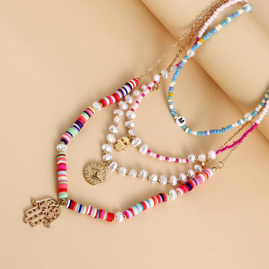 Collana con ciondolo Mano di Fatima in stile bohémien da donna con base in lega finitura galvanizzata e perline colorate in argilla polimerica