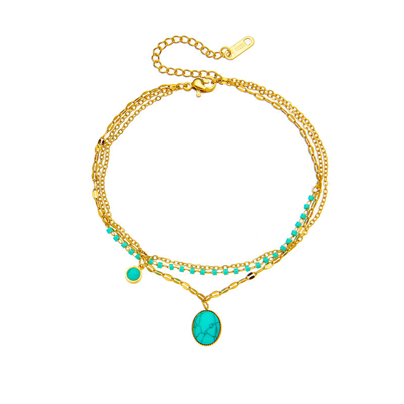 Bracciale con ciondolo ovale in turchese bohémien vintage in acciaio al titanio con finitura placcata