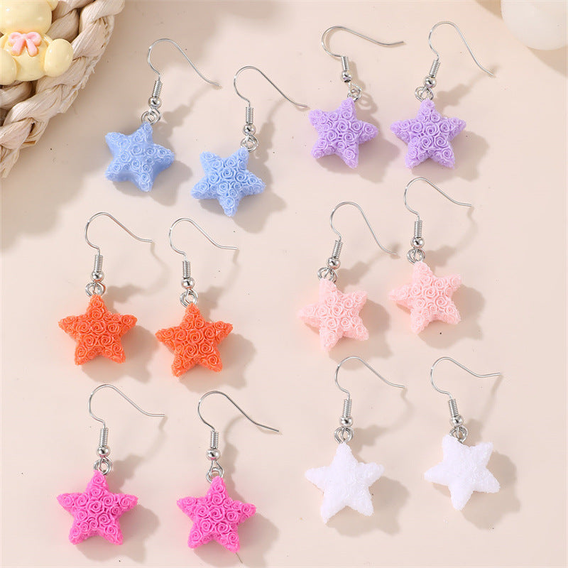 Set de aretes infantiles minimalistas con corazón floral, estrella y moño para niñas de 3 a 10 años, aretes de plástico y resina con incrustaciones de perlas