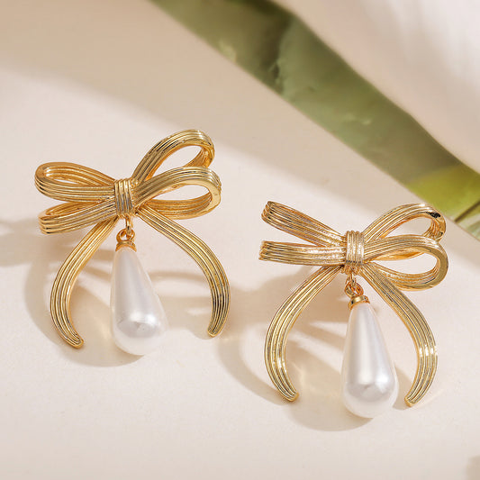 Fashionable Bowknot Pearl Drop Earrings for Women in Copper with 18K Gold Plating, Geometric and Irregular Design