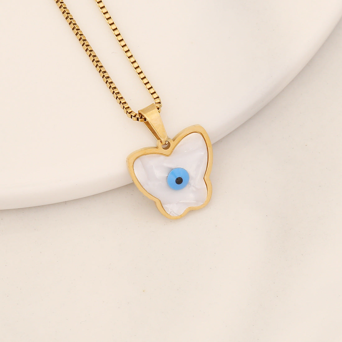 Collana con pendente a forma di occhio in acciaio inossidabile audace con finitura a olio a goccia