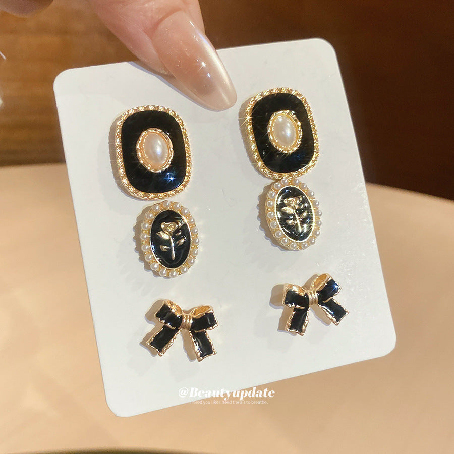 Orecchini a perno eleganti retrò a forma di fiocco con intarsio di strass e perni in acciaio per donna