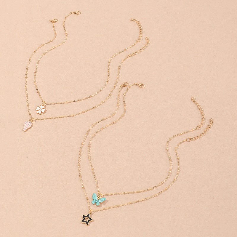 Set Collana per Bambini con Ciondoli a Cartone Animato Farfalla Stella Quadrifoglio Mongolfiera in Lega Smalto con Catena a Scatola