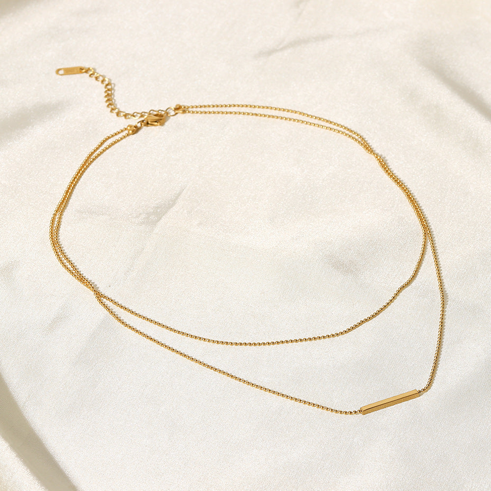 Collana doppia a strati a barra a T geometrica in acciaio inossidabile con pendente in acciaio al titanio placcato oro 18 carati da donna
