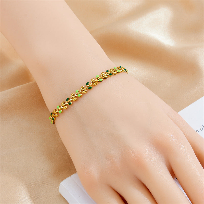 Bracciale da donna placcato oro minimalista in acciaio inossidabile con charm a foglia