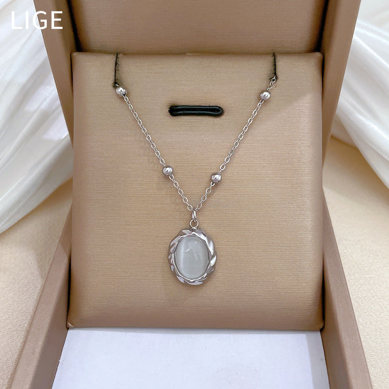 Collana girocollo da donna con ciondolo in pietra occhio di gatto girevole in acciaio inossidabile placcato oro dal design geometrico minimalista