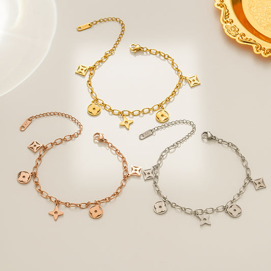 Pulsera de lujo para mujer con forma de rombo de acero de titanio chapado con borlas y diseño de trébol calado