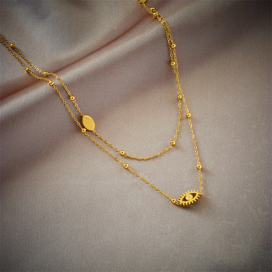 Collar con Colgante de Ojo Azul Hueco de Doble Capa Minimalista de Moda en Acero de Titanio con Cuentas Doradas y Acabado Esmaltado