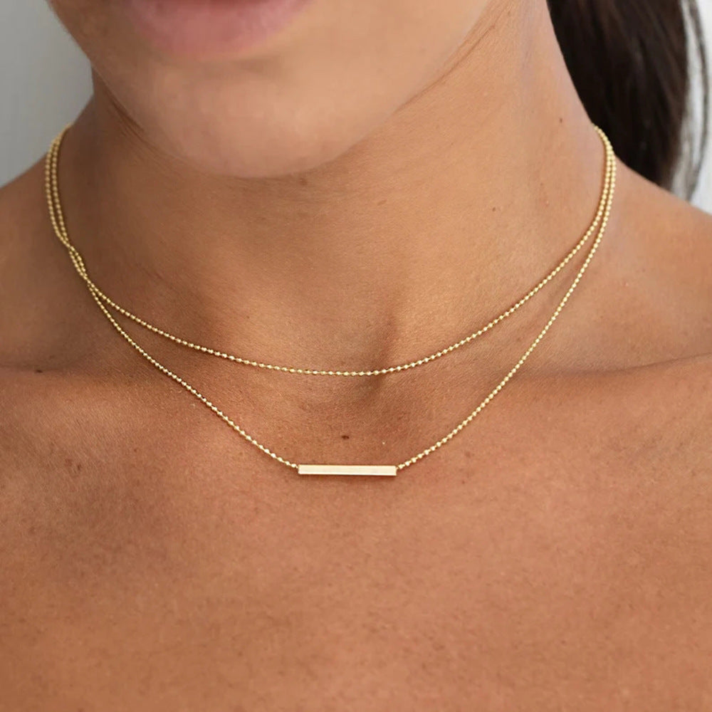 Collana doppia a strati a barra a T geometrica in acciaio inossidabile con pendente in acciaio al titanio placcato oro 18 carati da donna